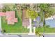 Aerial view of the neighborhood showcasing the properties, mature trees, and street at 827 Sikes Blvd, Lakeland, FL 33815