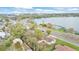 Aerial view of neighborhood with lake in background at 827 Sikes Blvd, Lakeland, FL 33815