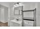 Bathroom featuring shower and tub combo, a new toilet, and laminate floors at 827 Sikes Blvd, Lakeland, FL 33815