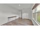 Bedroom featuring laminate floors, neutral walls, a built-in closet, and natural light at 827 Sikes Blvd, Lakeland, FL 33815