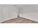 Bedroom with wood floors, and double door closet at 827 Sikes Blvd, Lakeland, FL 33815