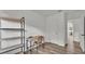 Bright room featuring wood floors, desk with shelving, and a neutral color palette at 827 Sikes Blvd, Lakeland, FL 33815