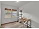 Bedroom featuring laminate floors, neutral walls, and natural light at 827 Sikes Blvd, Lakeland, FL 33815