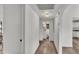 Hallway featuring laminate floors that leads to the other rooms in the home at 827 Sikes Blvd, Lakeland, FL 33815