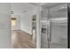 Bright kitchen includes stainless steel refrigerator, adjacent to a cozy dining and living area at 827 Sikes Blvd, Lakeland, FL 33815
