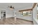 Open living room showcasing views to kitchen and dining areas plus natural light from large windows at 827 Sikes Blvd, Lakeland, FL 33815