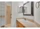 Bright bathroom featuring a sink and vanity with a standing shower at 8303 Waterview Way # 8303, Winter Haven, FL 33884