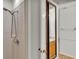 Bathroom featuring tile shower, wood vanity, and natural light at 8303 Waterview Way # 8303, Winter Haven, FL 33884