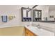 Bathroom featuring vanity with cabinet, mirror, lighting, towel racks, and neutral paint at 8303 Waterview Way # 8303, Winter Haven, FL 33884