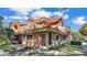 Charming townhome featuring a beautiful red tile roof and a cozy balcony, nestled within a lush, landscaped community at 8303 Waterview Way # 8303, Winter Haven, FL 33884