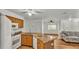 Kitchen featuring wooden cabinets, granite countertops, and stainless steel appliances at 8303 Waterview Way # 8303, Winter Haven, FL 33884