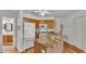 Kitchen showcasing wooden cabinets, tile countertops, and stainless steel appliances at 8303 Waterview Way # 8303, Winter Haven, FL 33884