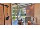 Enclosed lanai with neutral toned walls and open view of outside landscaping at 8303 Waterview Way # 8303, Winter Haven, FL 33884