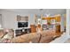 Comfortable living area with wood floors seamlessly connects to the kitchen, creating an inviting open-concept space at 8303 Waterview Way # 8303, Winter Haven, FL 33884