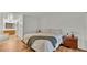 Comfortable bedroom featuring light wood floors and ensuite bathroom access at 8303 Waterview Way # 8303, Winter Haven, FL 33884