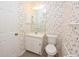 Cozy bathroom featuring a mirror, toilet, and sink at 1065 Jordan Rd, Lakeland, FL 33811