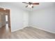 Bedroom featuring a ceiling fan, light gray walls and wood flooring at 1065 Jordan Rd, Lakeland, FL 33811