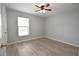 Bedroom with a ceiling fan, light gray walls and new wood flooring at 1065 Jordan Rd, Lakeland, FL 33811