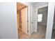 Hallway view of bedroom with a light gray wall and new wood flooring at 1065 Jordan Rd, Lakeland, FL 33811