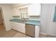 A functional kitchen design featuring white cabinets and stainless steel appliances at 1065 Jordan Rd, Lakeland, FL 33811