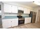 Bright kitchen featuring modern stainless steel appliances and white cabinetry at 1065 Jordan Rd, Lakeland, FL 33811