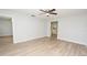 Open living room with ceiling fan, new floors, and neutral paint at 1065 Jordan Rd, Lakeland, FL 33811