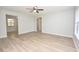 Bright living room with ceiling fan, new floors, and neutral paint at 1065 Jordan Rd, Lakeland, FL 33811