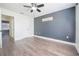 Bedroom with new floors and a ceiling fan; doorway on the left at 1100 Lowry Ave # 51, Lakeland, FL 33801