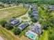 Aerial view of the community highlighting the pool, mature landscaping, and surrounding neighborhood at 1108 Stoney Creek Blvd, Lakeland, FL 33811