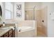 This bathroom features a soaking tub and a glass shower at 1108 Stoney Creek Blvd, Lakeland, FL 33811