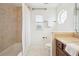 Cozy bathroom with a shower/tub combo and vanity at 1108 Stoney Creek Blvd, Lakeland, FL 33811