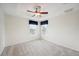 Bedroom featuring two windows and neutral carpet at 1108 Stoney Creek Blvd, Lakeland, FL 33811