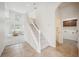 Bright foyer features a staircase, tile flooring, and view into an adjacent living room at 1108 Stoney Creek Blvd, Lakeland, FL 33811