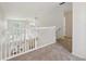 This hallway overlooks the living room and entryway at 1108 Stoney Creek Blvd, Lakeland, FL 33811