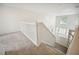 This hallway overlooks the downstairs living room and entryway at 1108 Stoney Creek Blvd, Lakeland, FL 33811