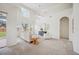 Spacious living room featuring a large window with natural light, neutral tones, and high ceilings at 1108 Stoney Creek Blvd, Lakeland, FL 33811