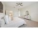 This main bedroom has a ceiling fan and access to the Primary bathroom at 1108 Stoney Creek Blvd, Lakeland, FL 33811