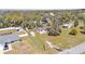 Drone image capturing the home's placement on a spacious lot with surrounding trees and neighbors at 111 Klein Ct, Lakeland, FL 33813