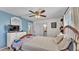 Bedroom featuring blue accent wall and natural light from the windows at 111 Klein Ct, Lakeland, FL 33813