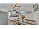 Dining space showcasing a rustic wooden table adjacent to a modern kitchen at 111 Klein Ct, Lakeland, FL 33813