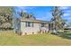 Exterior view of home featuring siding, lush landscaping, and curb appeal at 111 Klein Ct, Lakeland, FL 33813