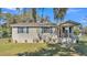 Charming single-story home featuring neutral siding, blue shutters, and a cozy front porch at 111 Klein Ct, Lakeland, FL 33813