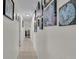 Well-lit hallway adorned with Gathering photos creates a warm, inviting atmosphere at 111 Klein Ct, Lakeland, FL 33813