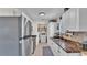 Functional kitchen featuring stainless steel appliances, ample counter space, and a laundry area at 111 Klein Ct, Lakeland, FL 33813