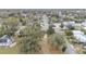 Overhead shot showcasing the property's location in a neighborhood setting with mature trees at 1243 Olive St, Lakeland, FL 33815