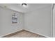 Bedroom features wood-look flooring, a window, and neutral paint at 1243 Olive St, Lakeland, FL 33815