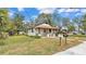 Exterior view of home featuring well-maintained lawn and charming curb appeal at 1243 Olive St, Lakeland, FL 33815