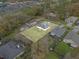 Aerial view of the backyard showing the house, yard, and surrounding properties at 1415 Pinewood Ave, Lakeland, FL 33803