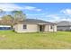 A backyard with a grassy area perfect for outdoor activities at 1415 Pinewood Ave, Lakeland, FL 33803