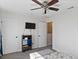 This bedroom features a ceiling fan, neutral walls, and multiple doorways for easy access at 14439 Prunningwood Pl, Winter Garden, FL 34787